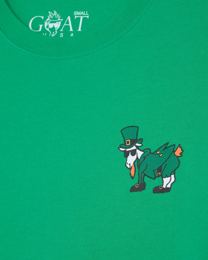Green t-shirt with a cartoon goat wearing a top hat and shoes on a green background.
