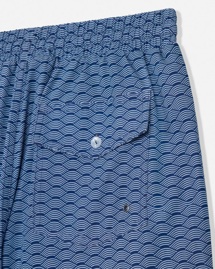 Blue patterned shorts with a pocket on a white background