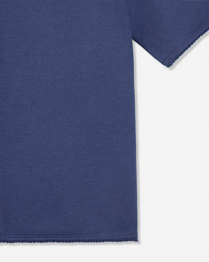 Close-up of hem on navy french terry tee#color_navy