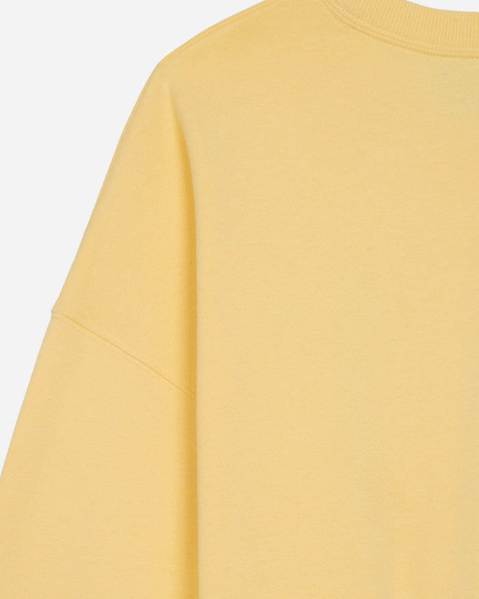 Back shoulder of oversized corn milk crewneck#color_corn-milk
