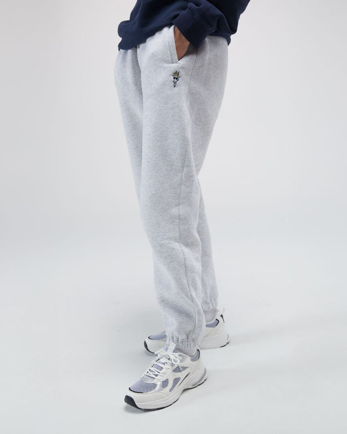 Person wearing sweatpants with a small logo#color_pale-gray